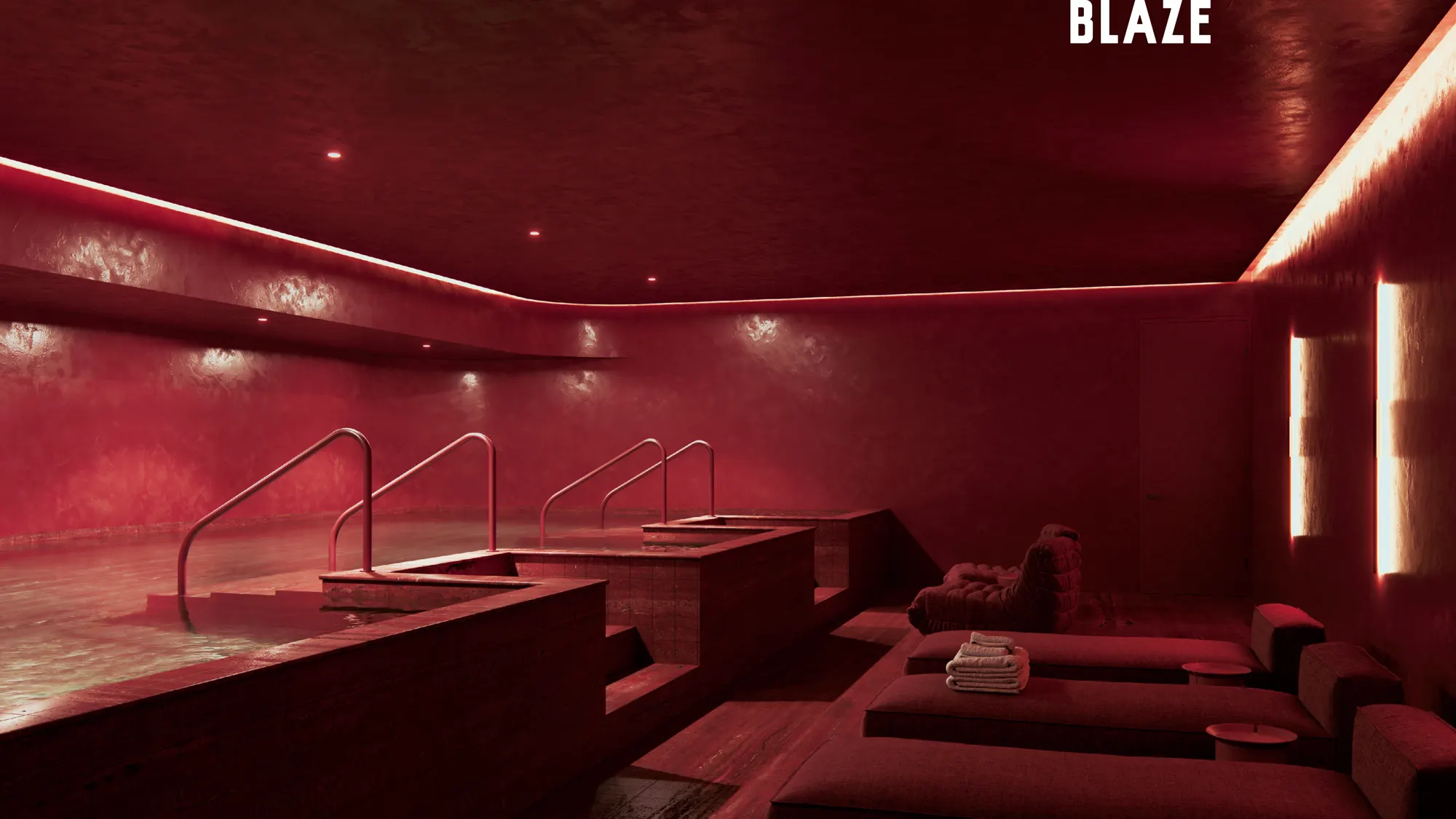 Blaze spa with red indoor pool and loungers